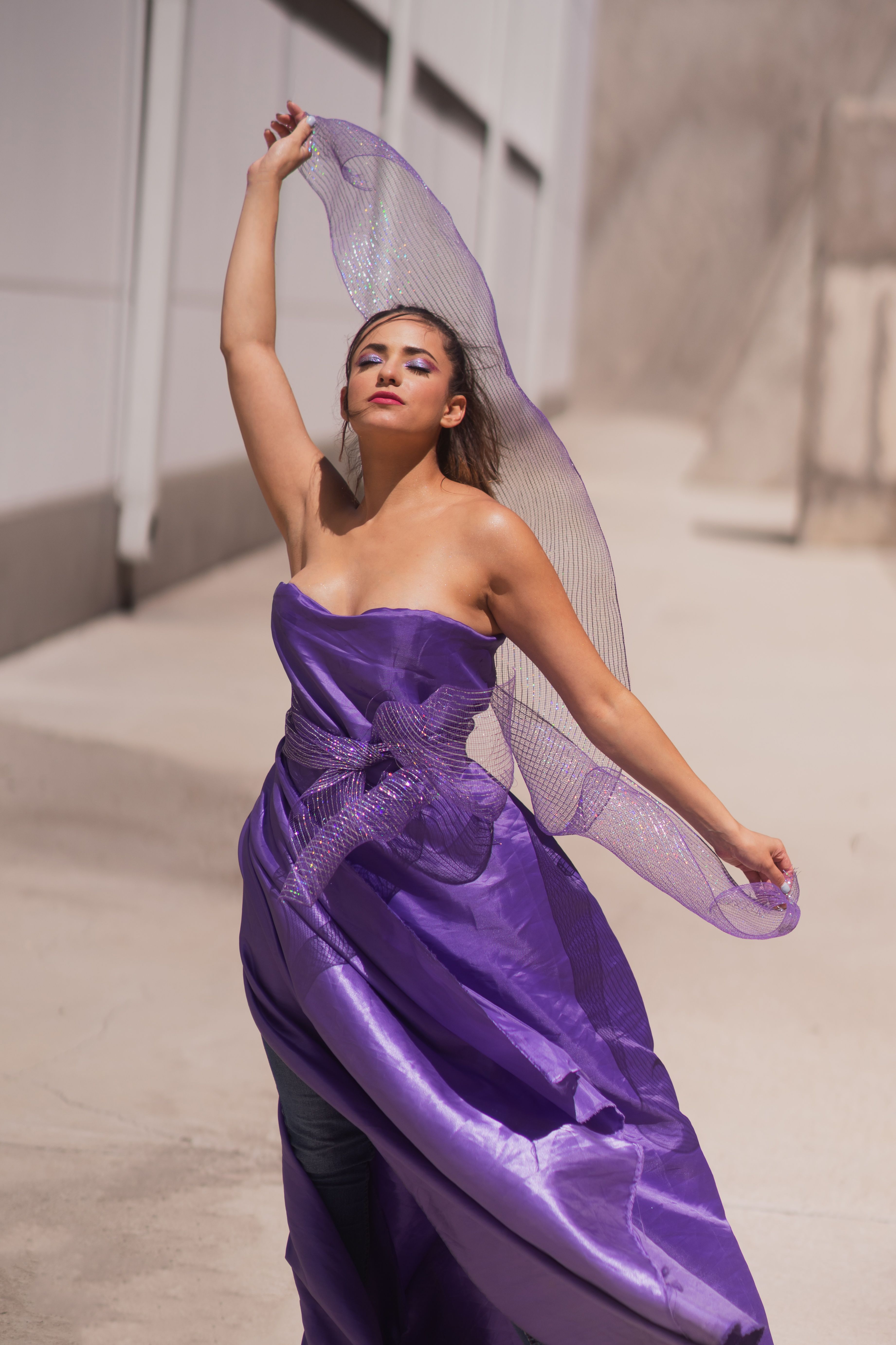 Elegant Woman in Flowing Purple Dress Outdoors · Free Stock Photo