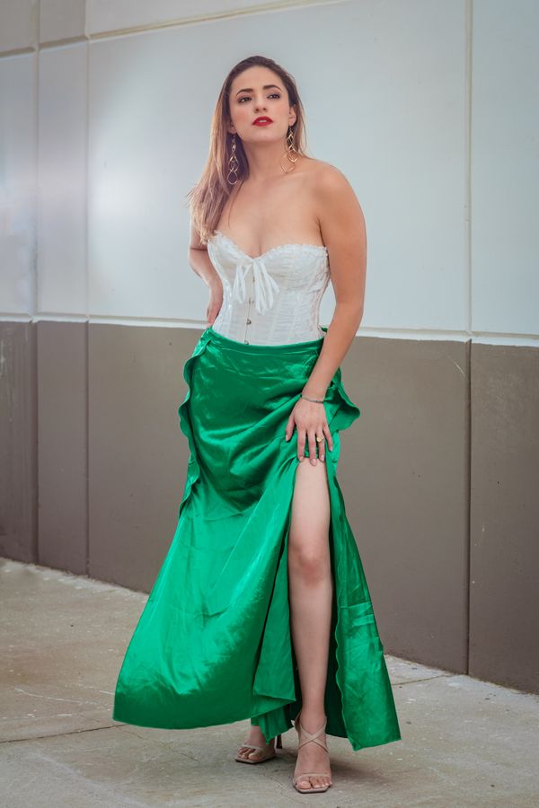 Woman wearing a corset top with a satin maxi skirt