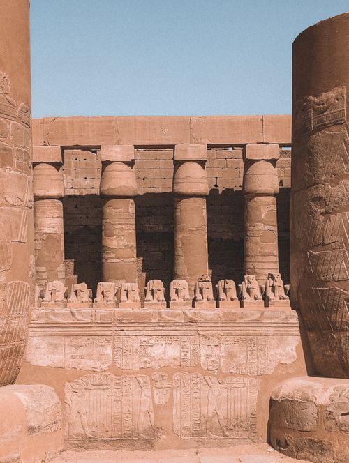 Free View of ancient columns and carvings at Karnak Temple in Luxor, Egypt, showcasing iconic Egyptian architecture. Stock Photo