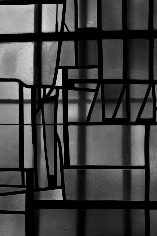 Free Black and white abstract stained glass window with geometric patterns. Stock Photo