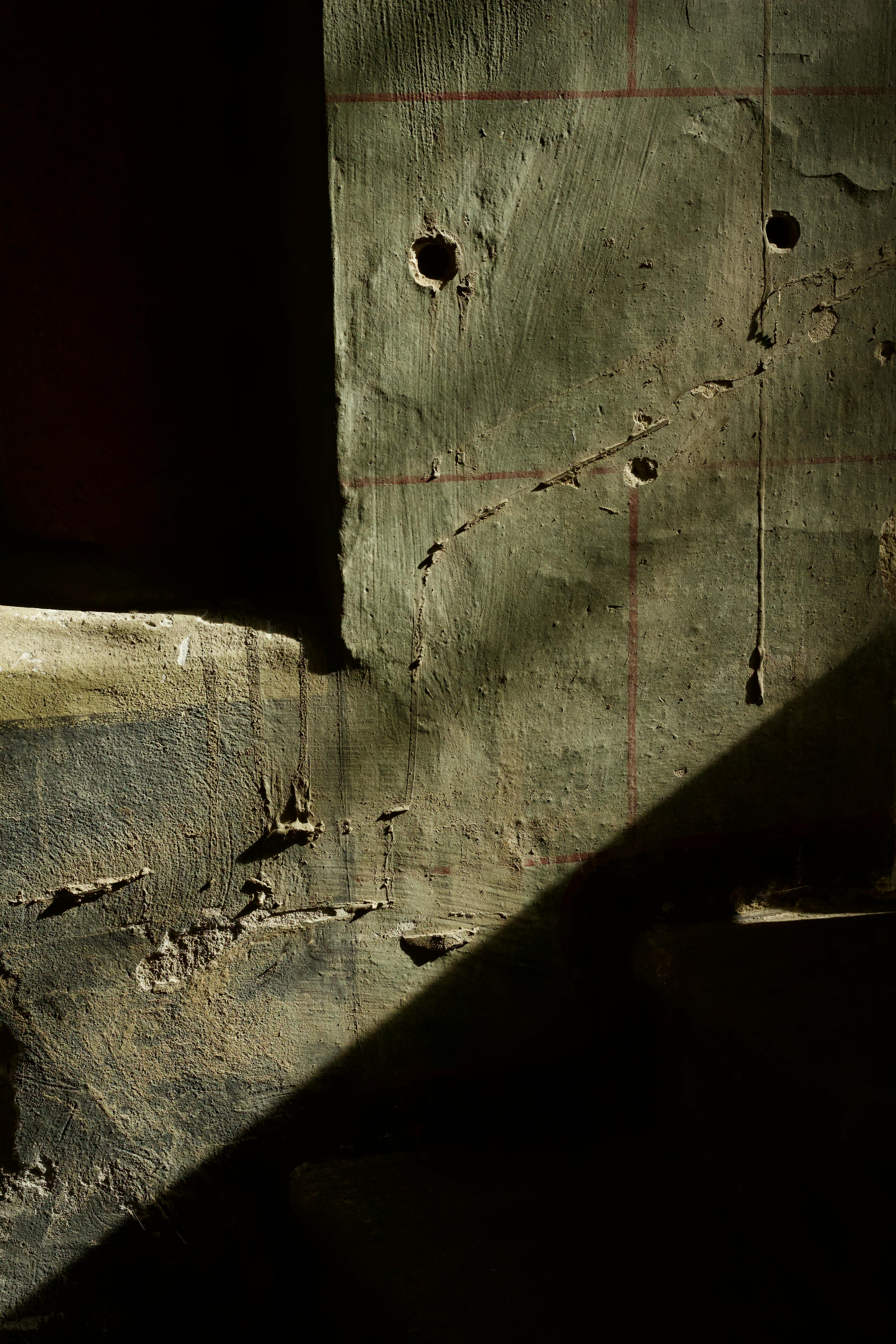 Free Abstract shot of a textured wall with dramatic shadows and light. Stock Photo