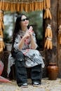 Stylish Woman Relaxing in Corn-decorated Outdoor Setting