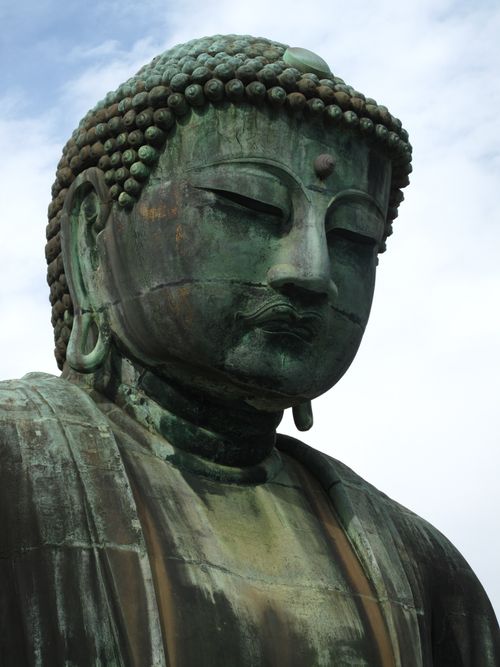 Free Close-up of the Great Buddha statue in Kamakura, showcasing intricate details of the bronze artistry. Stock Photo