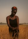 Serene Portrait of Woman in Golden Field at Dusk