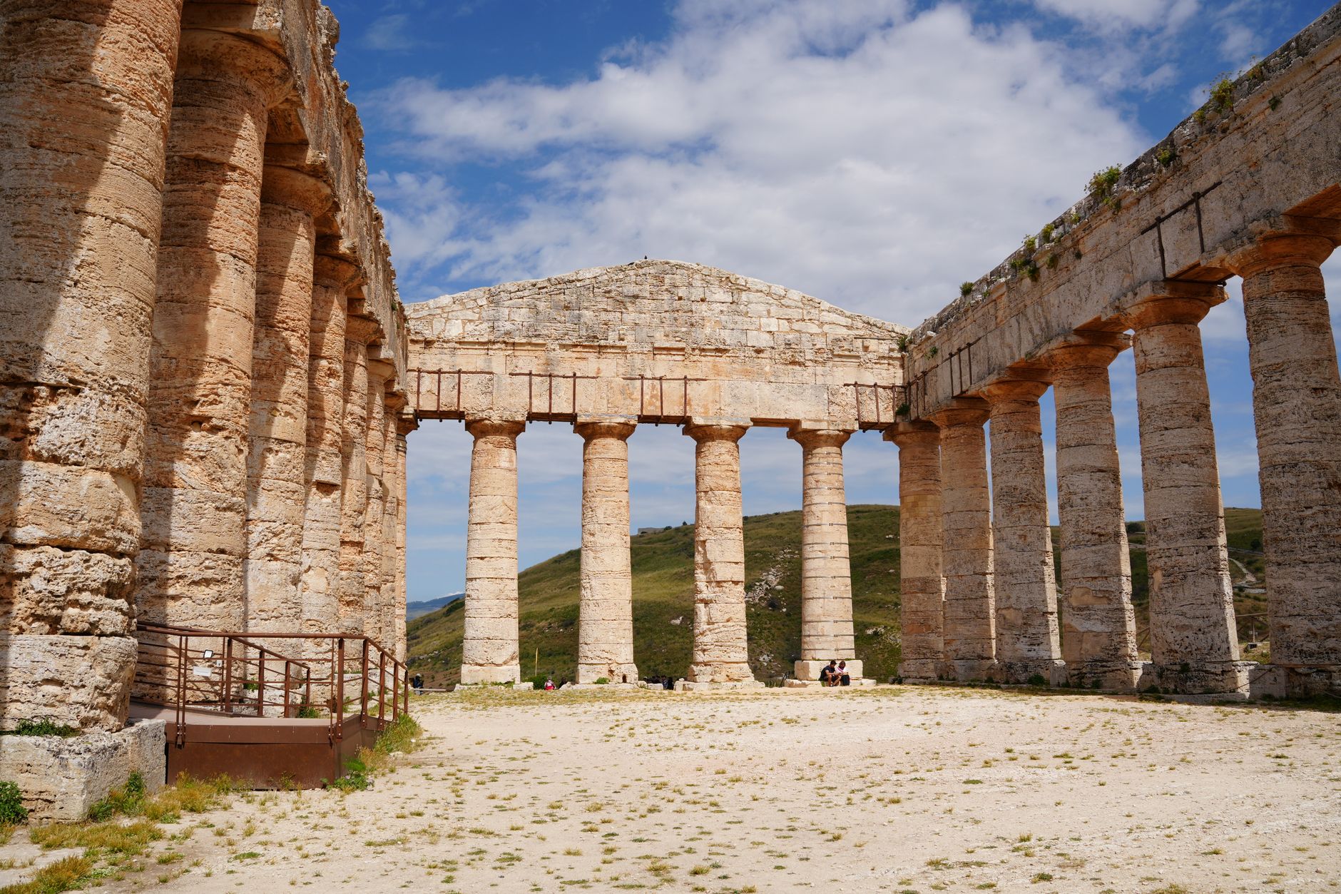 Segesta ancient Doric temple with complete limestone colonnade on an open grass hilltop in western Sicily