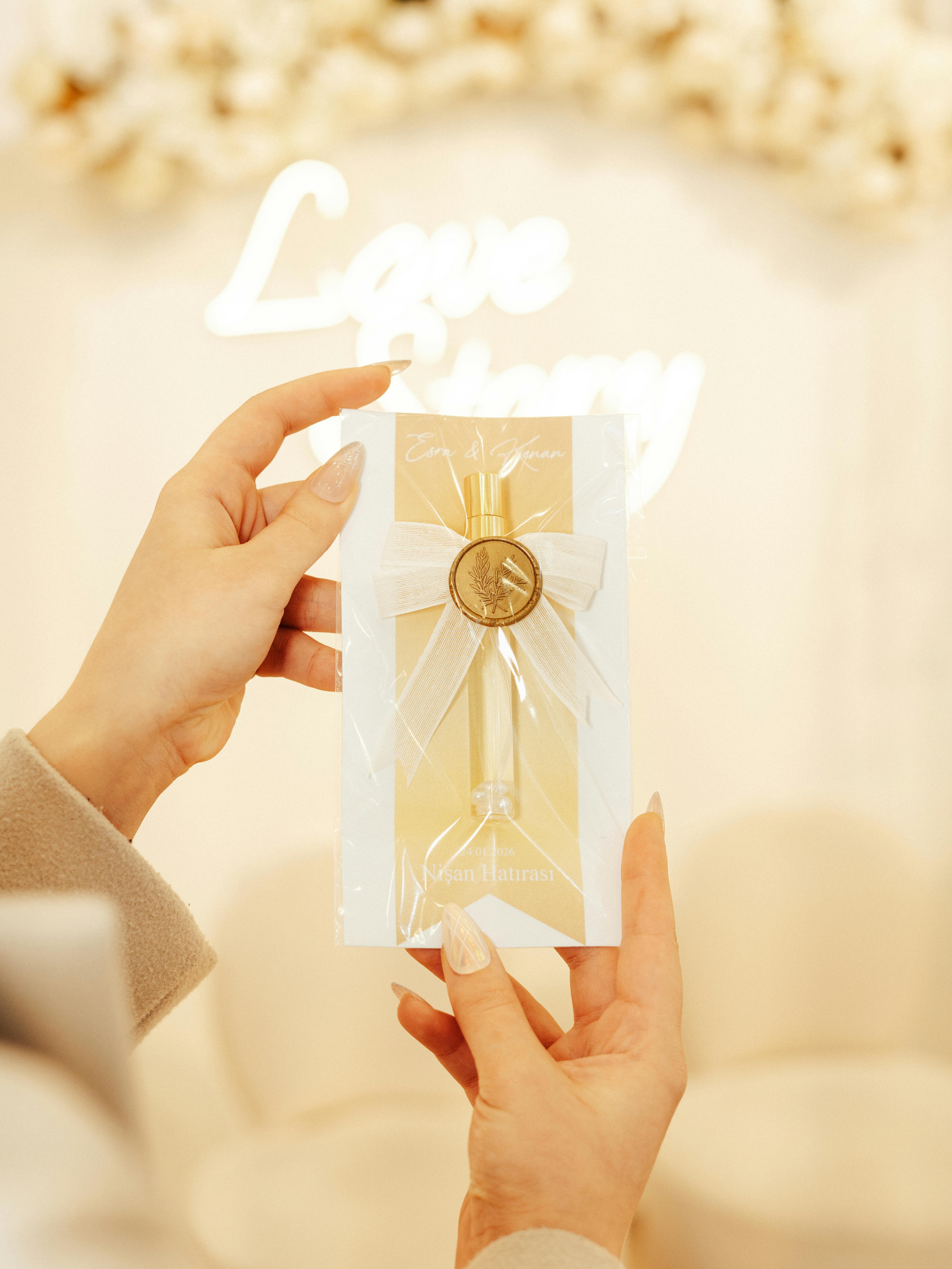A close-up of a luxurious wedding invitation with a golden bow, perfect for a chic ceremony.