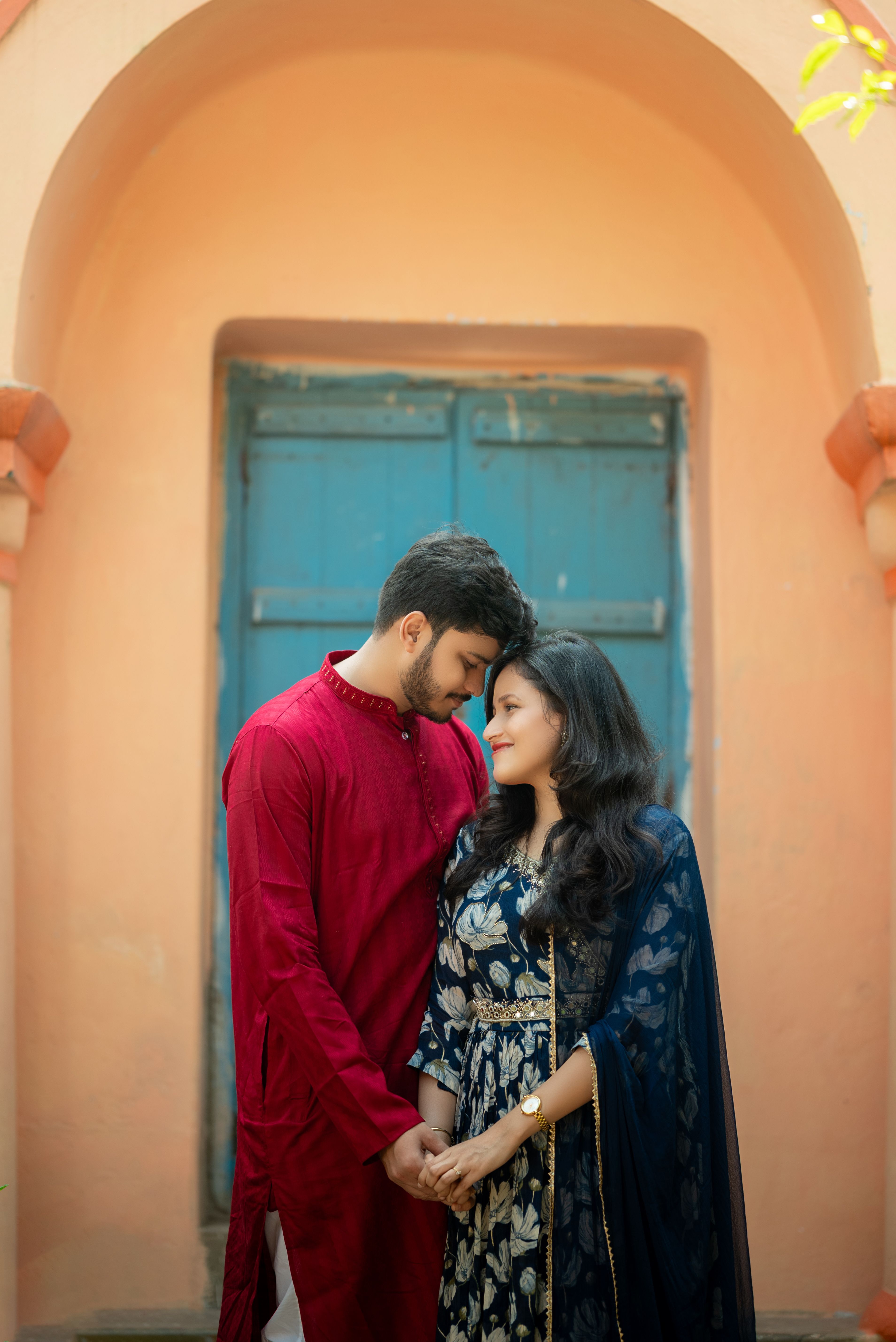 Romantic Couple Embracing in Traditional Indian Attire · Free Stock Photo