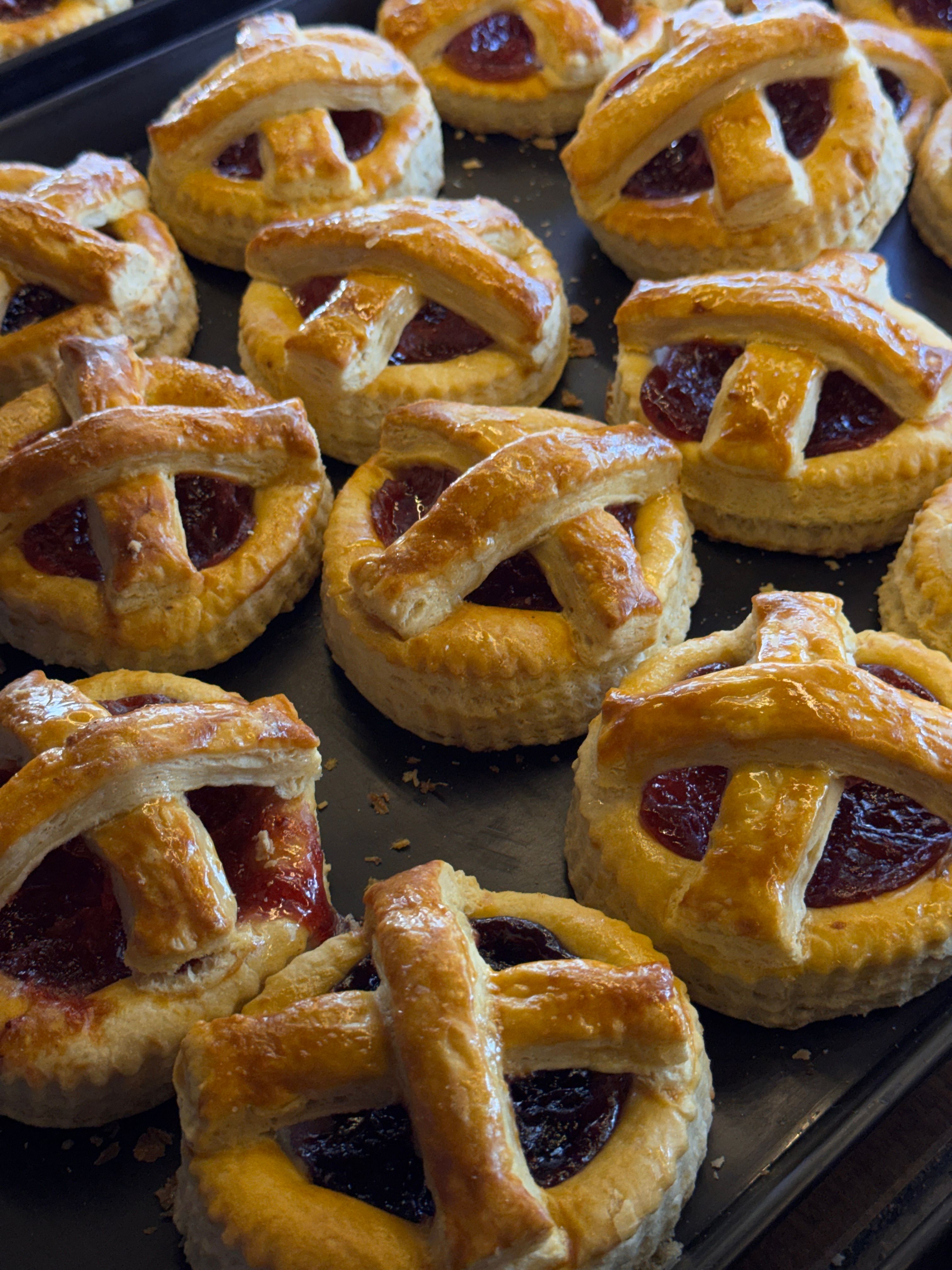 Tempting homemade mini fruit pies with lattice crust, freshly baked.
