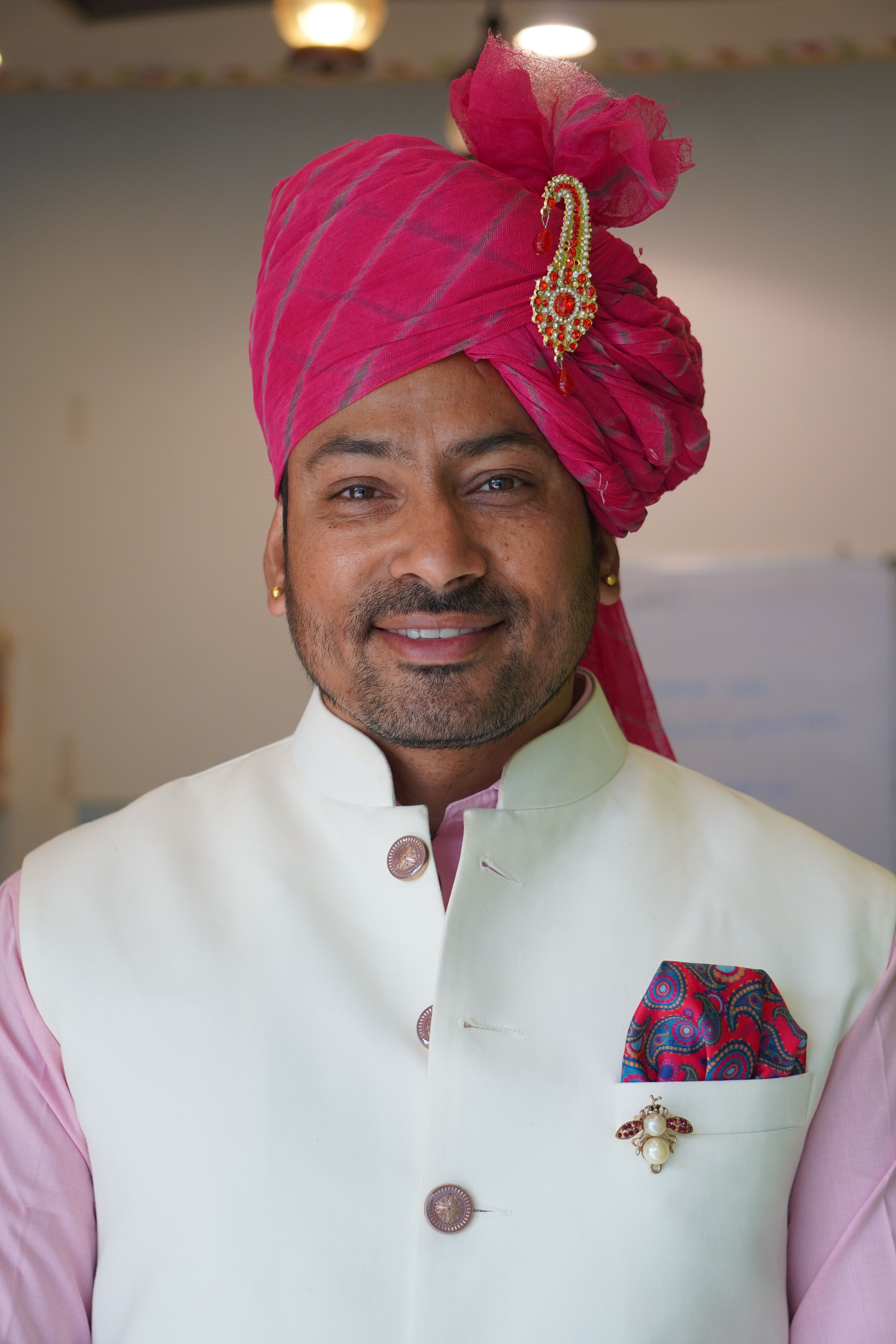 Man in Traditional Attire with Pink Turban · Free Stock Photo