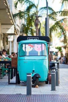 Vibrant food truck offering gelato on a sunny street in Montevideo.