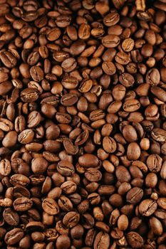 Close-up of rich roasted coffee beans, perfect for cafe or culinary themes.