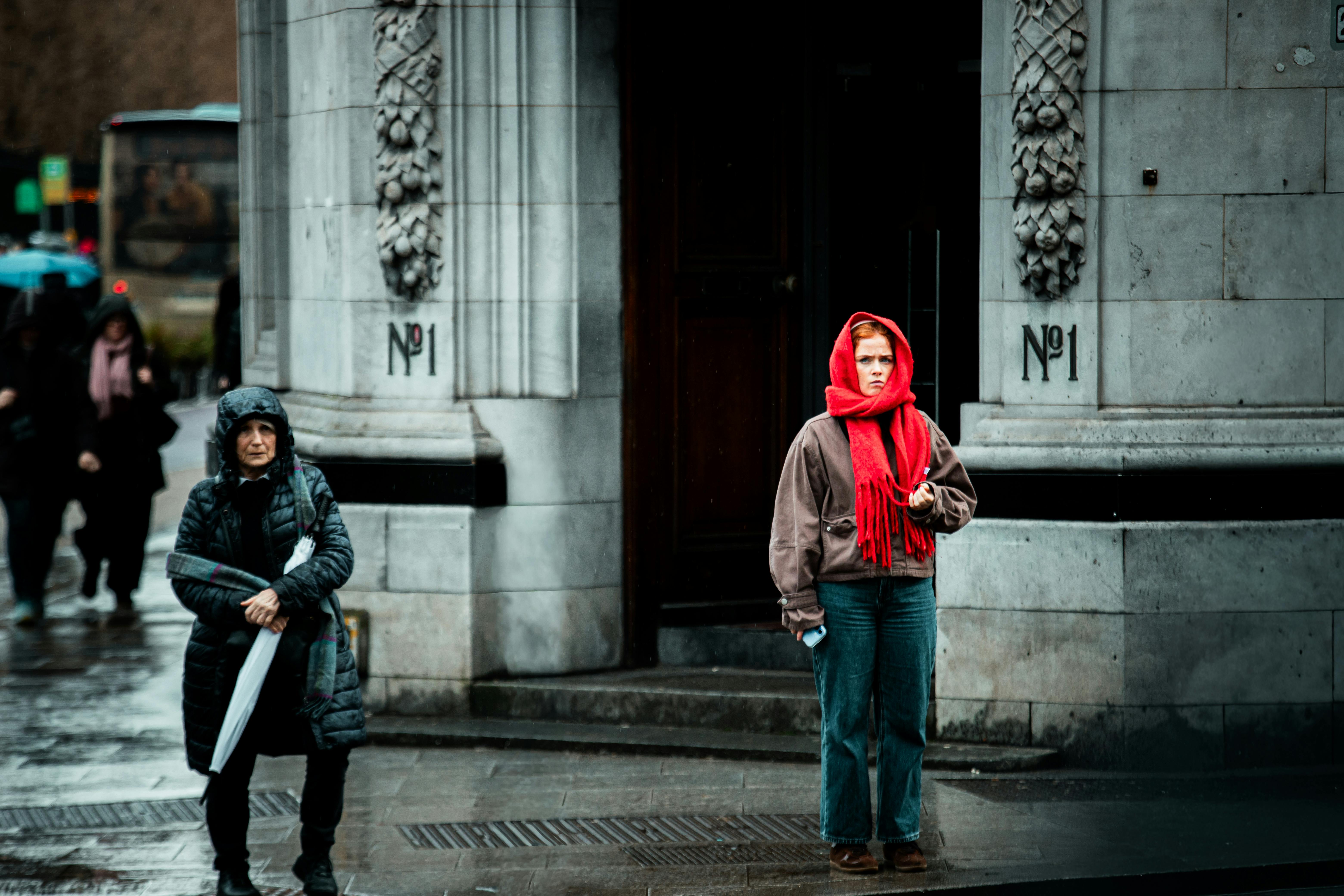 Free Candid street scene in Dublin with pedestrians in winter attire, highlighting urban life. Stock Photo