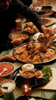 A vibrant spread of traditional Indonesian dishes served at a festive gathering.