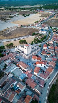Explore the historic Portillo Castle surrounded by charming Spanish village scenery.