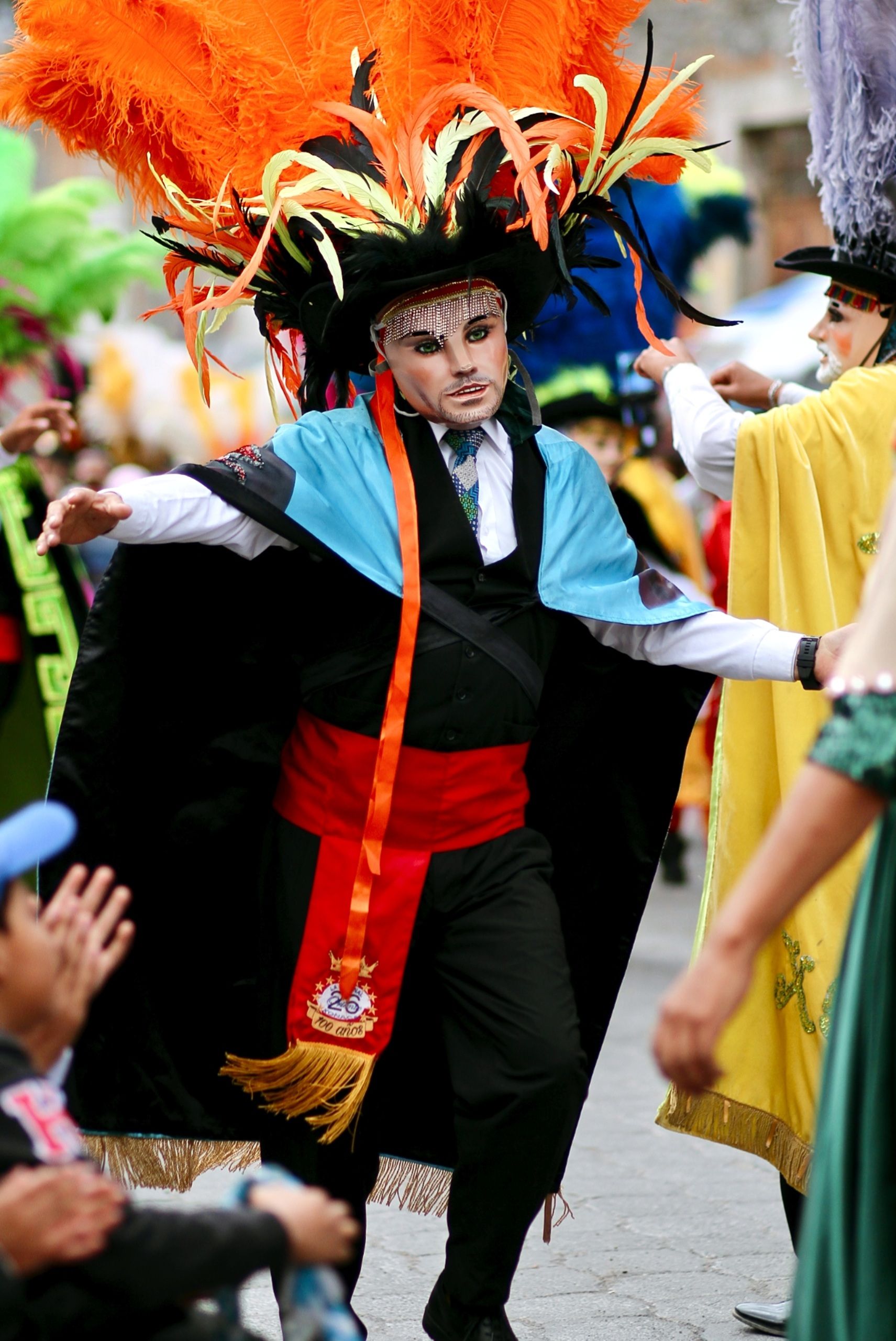 Colorful traditional dancer performs at a lively festival in Puebla, México. Captures cultural heritage.