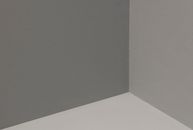 Abstract view of a minimalist corner with gray and white walls, showcasing simplicity and elegance.