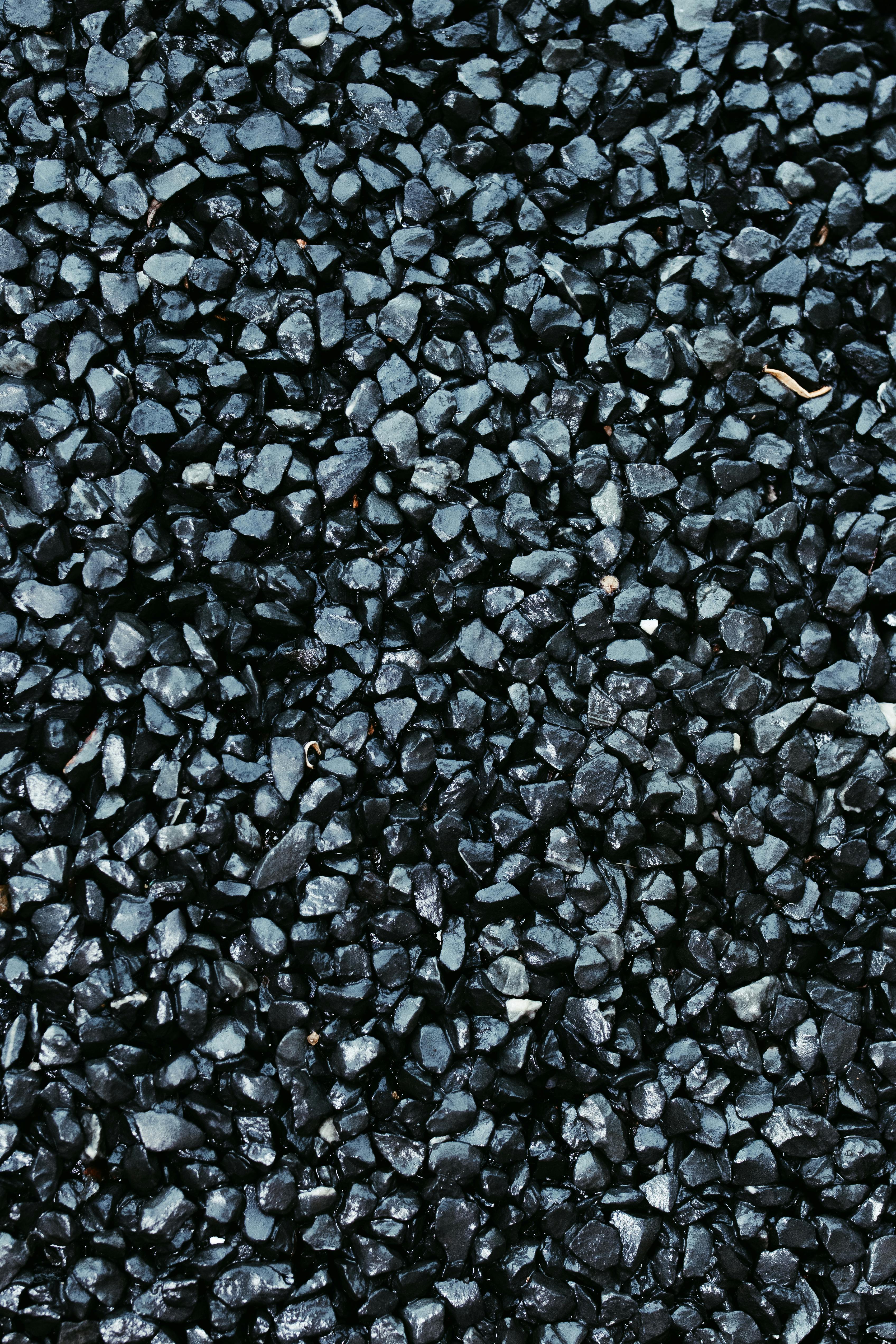 Free High-resolution close-up of dark gravel texture, ideal for backgrounds and design projects. Stock Photo