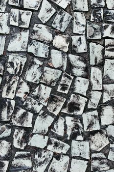 High-resolution abstract background featuring a weathered stone texture with mosaic pattern.