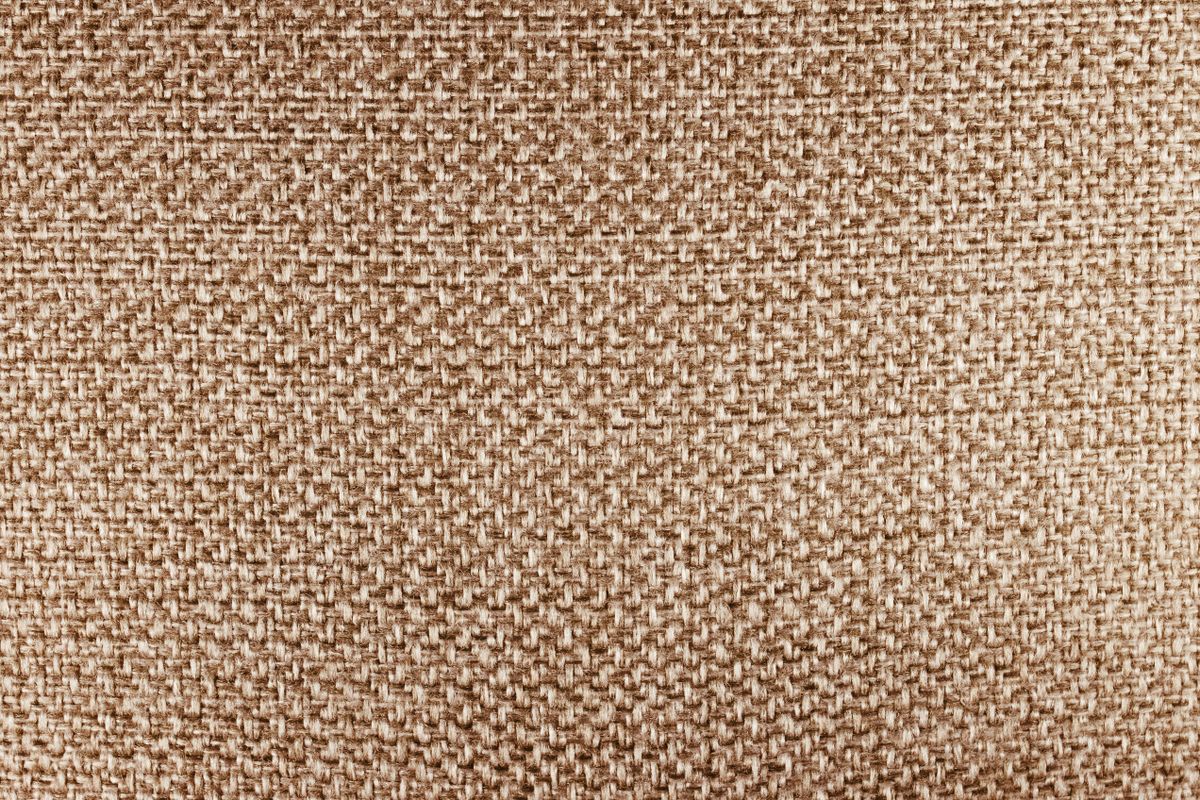Close-up of woven beige fabric texture
