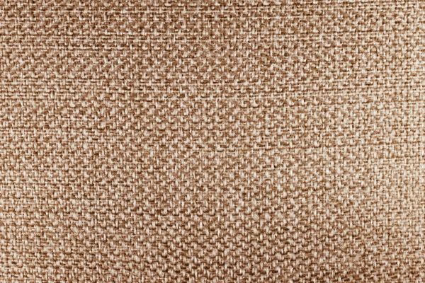 Close-up of woven beige fabric texture