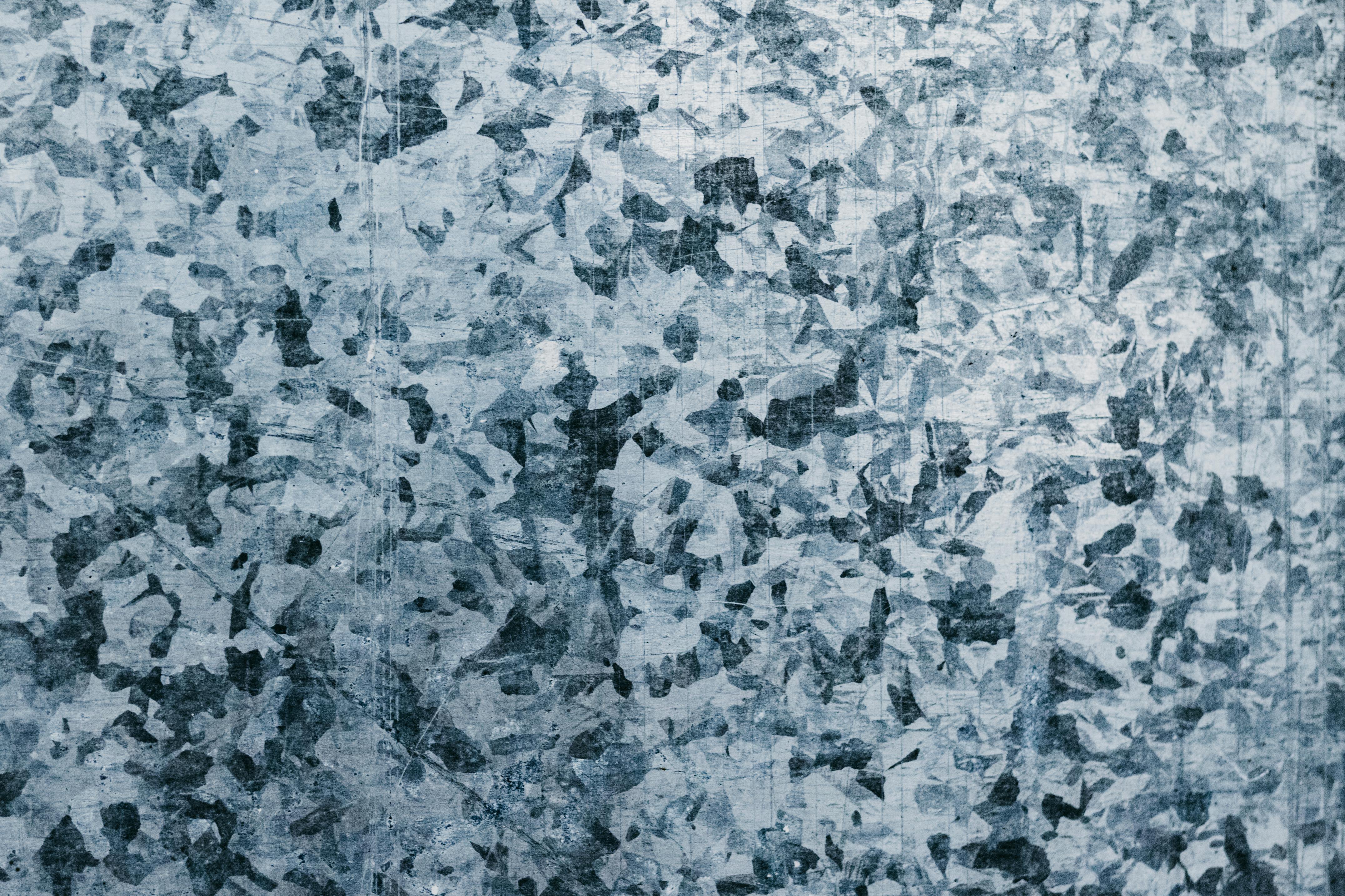 Gratuit Image abstraite haute résolution présentant une surface métallique texturée avec un motif unique. Photos