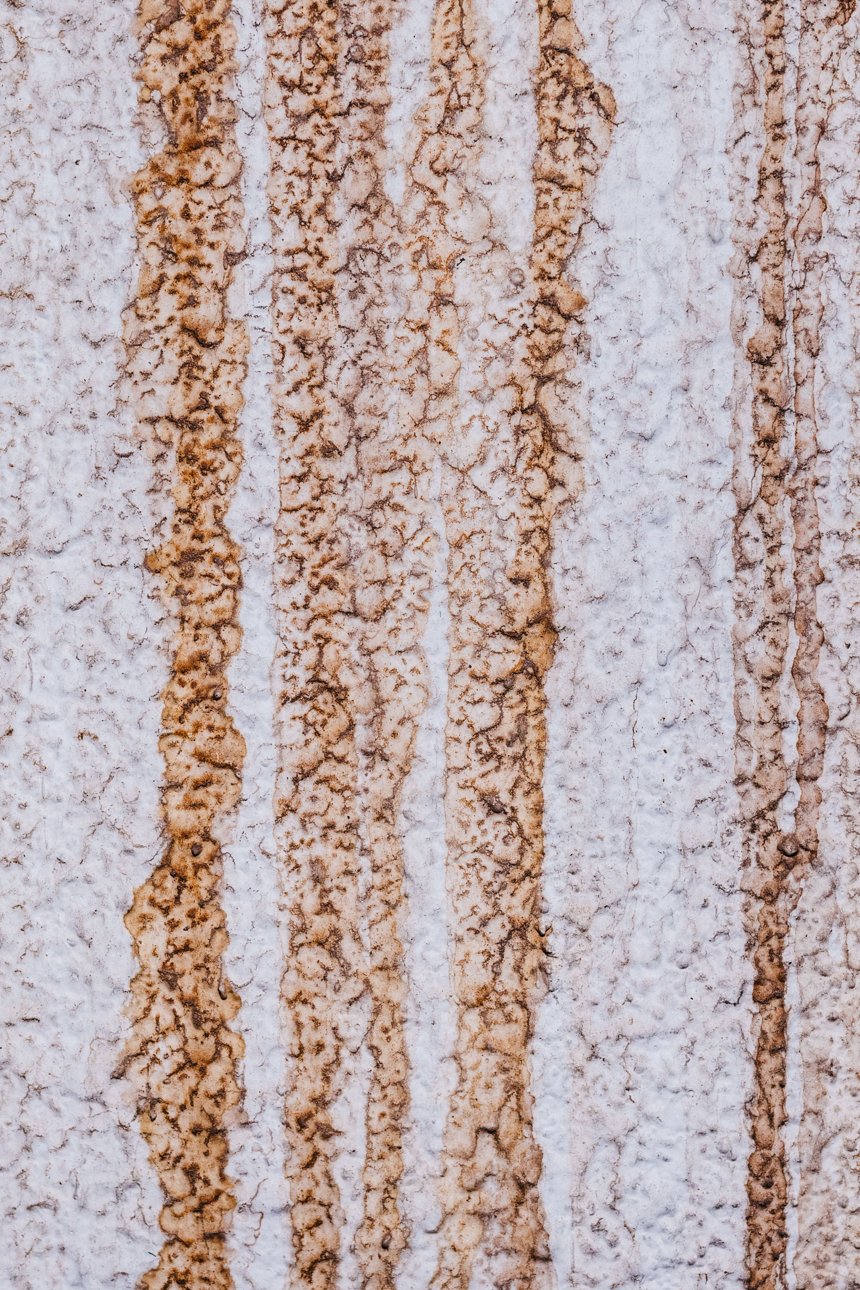 Close-up of Textured Rust Stains on Wall · Free Stock Photo