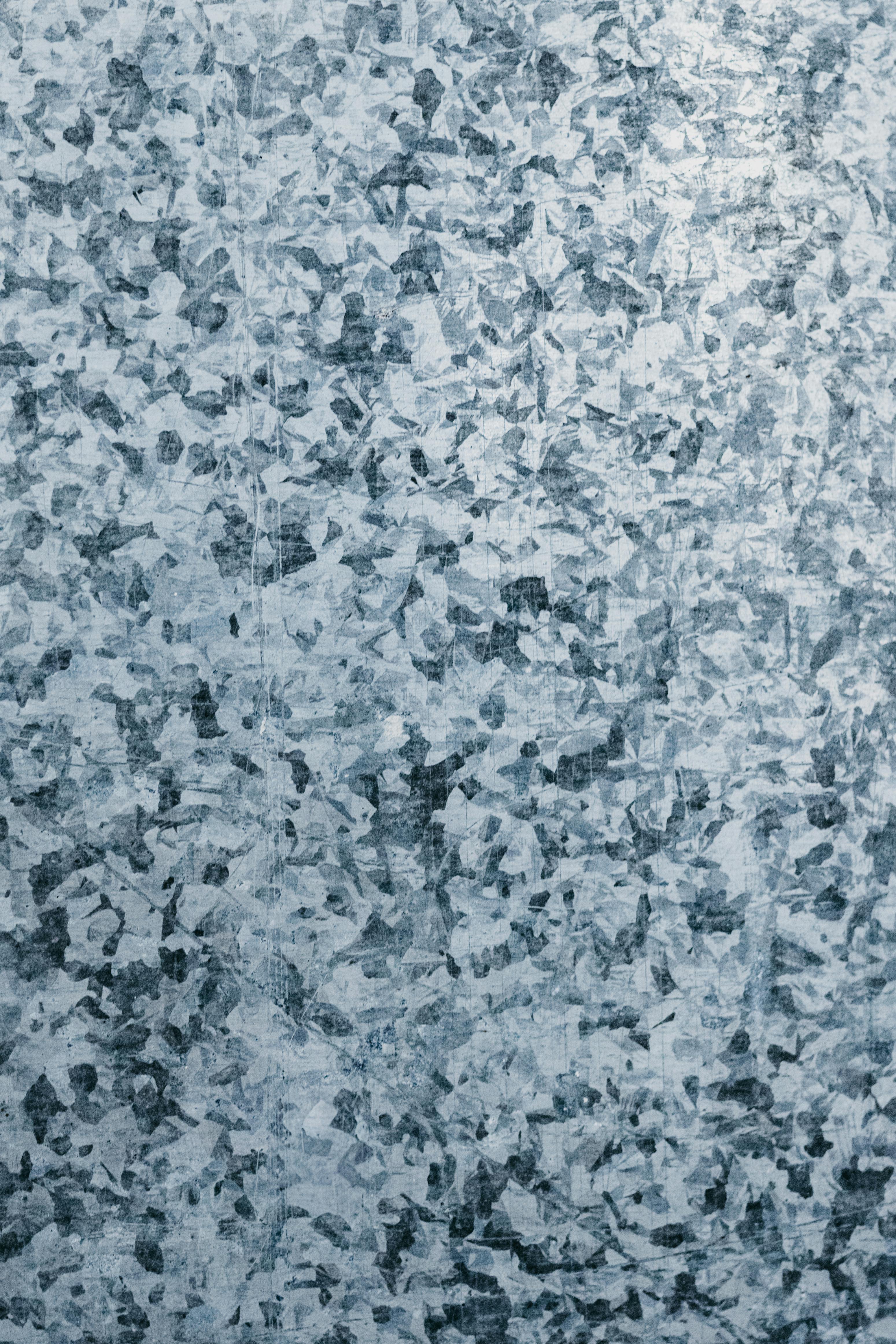 Free Detailed close-up image of a galvanized steel surface showing its unique texture. Stock Photo