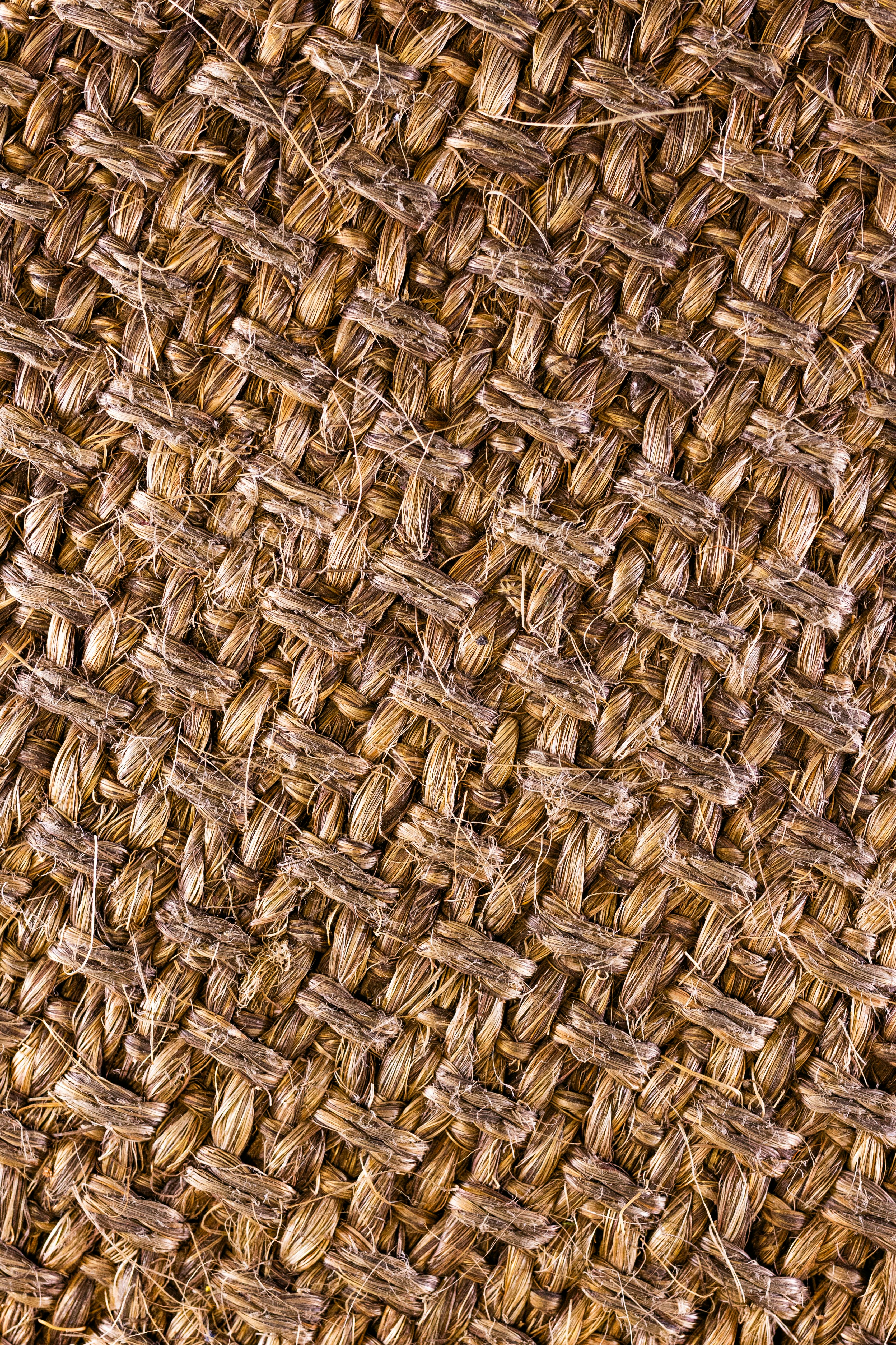 Free A detailed view of woven jute fabric showcasing its rich, natural fiber texture. Stock Photo