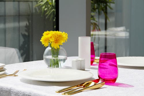 Free Table Setting with Golden Cutlery Stock Photo