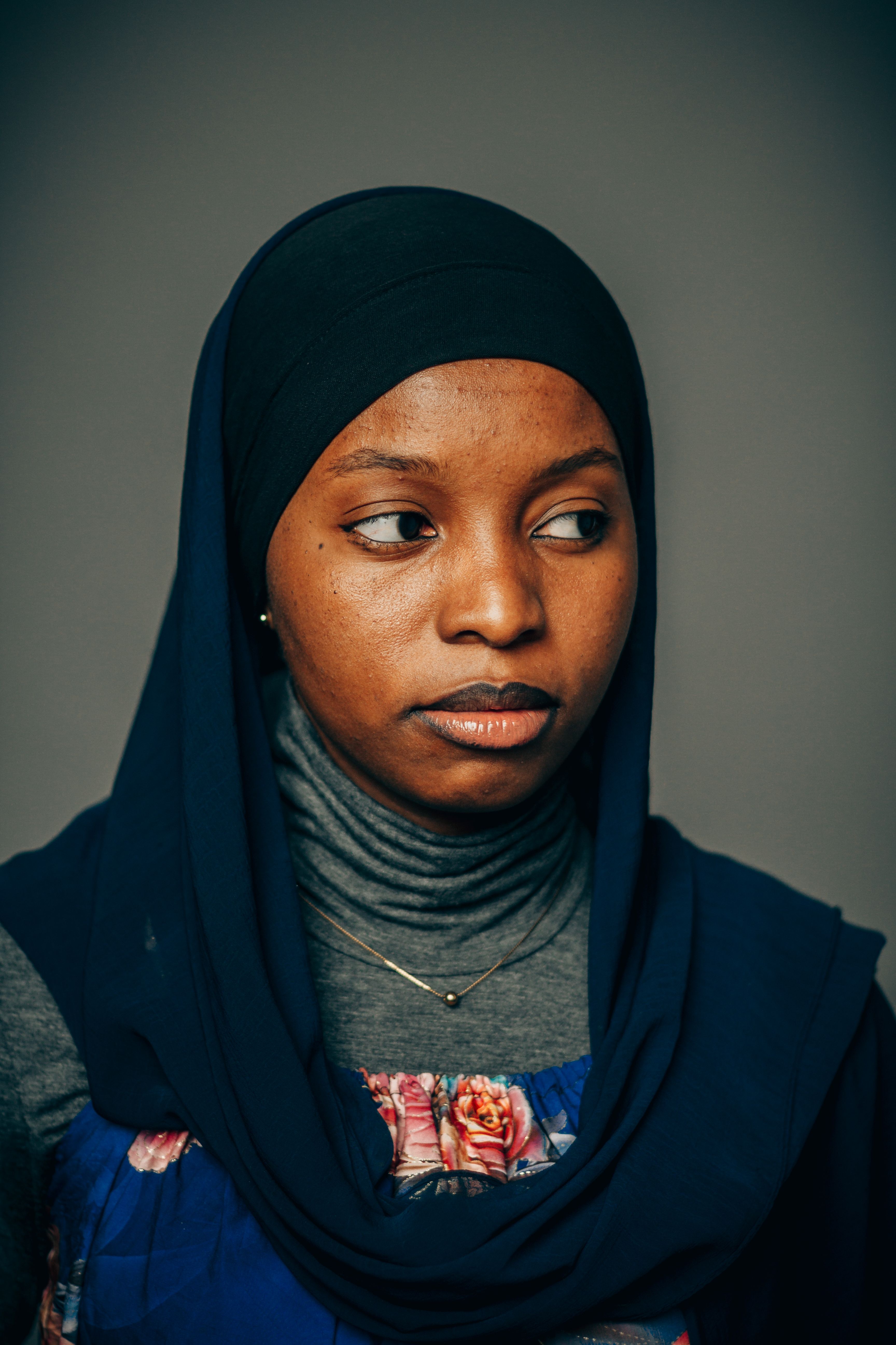 Portrait of Woman in Blue Hijab on Grey Background · Free Stock Photo