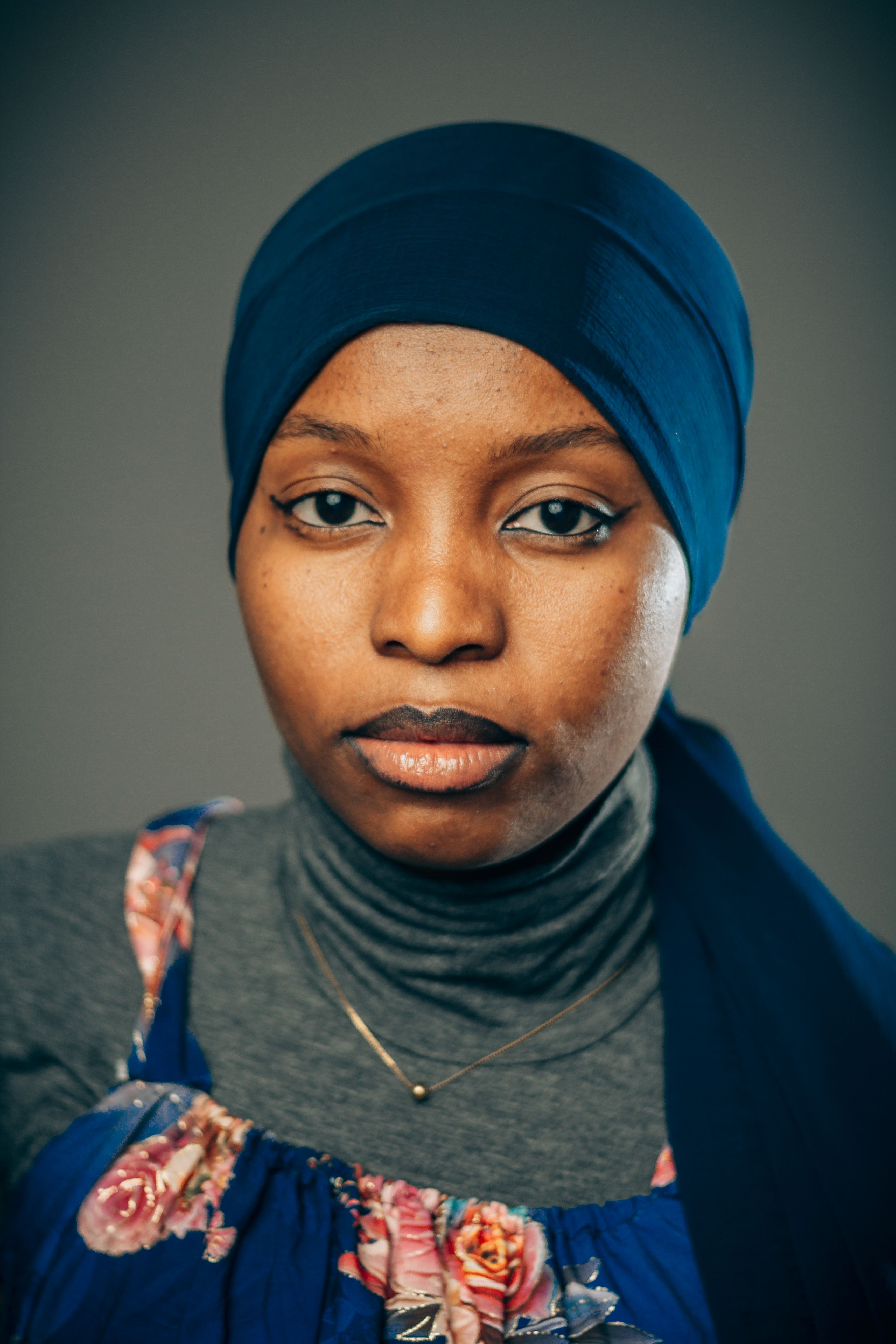 Elegant Portrait of a Woman in Blue Hijab · Free Stock Photo