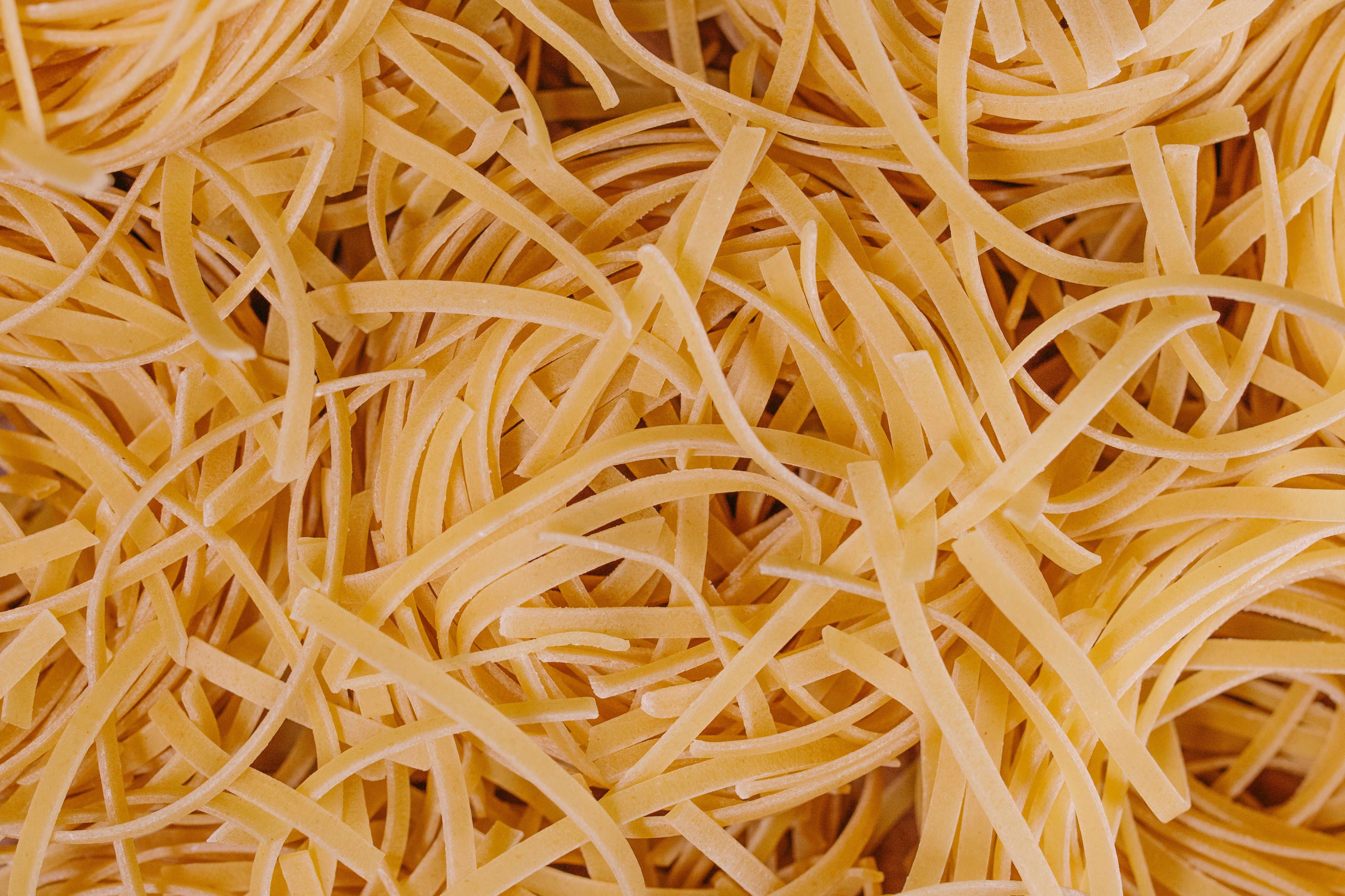Tagliolini pasta with pine nuts, herbs, and grated cheese