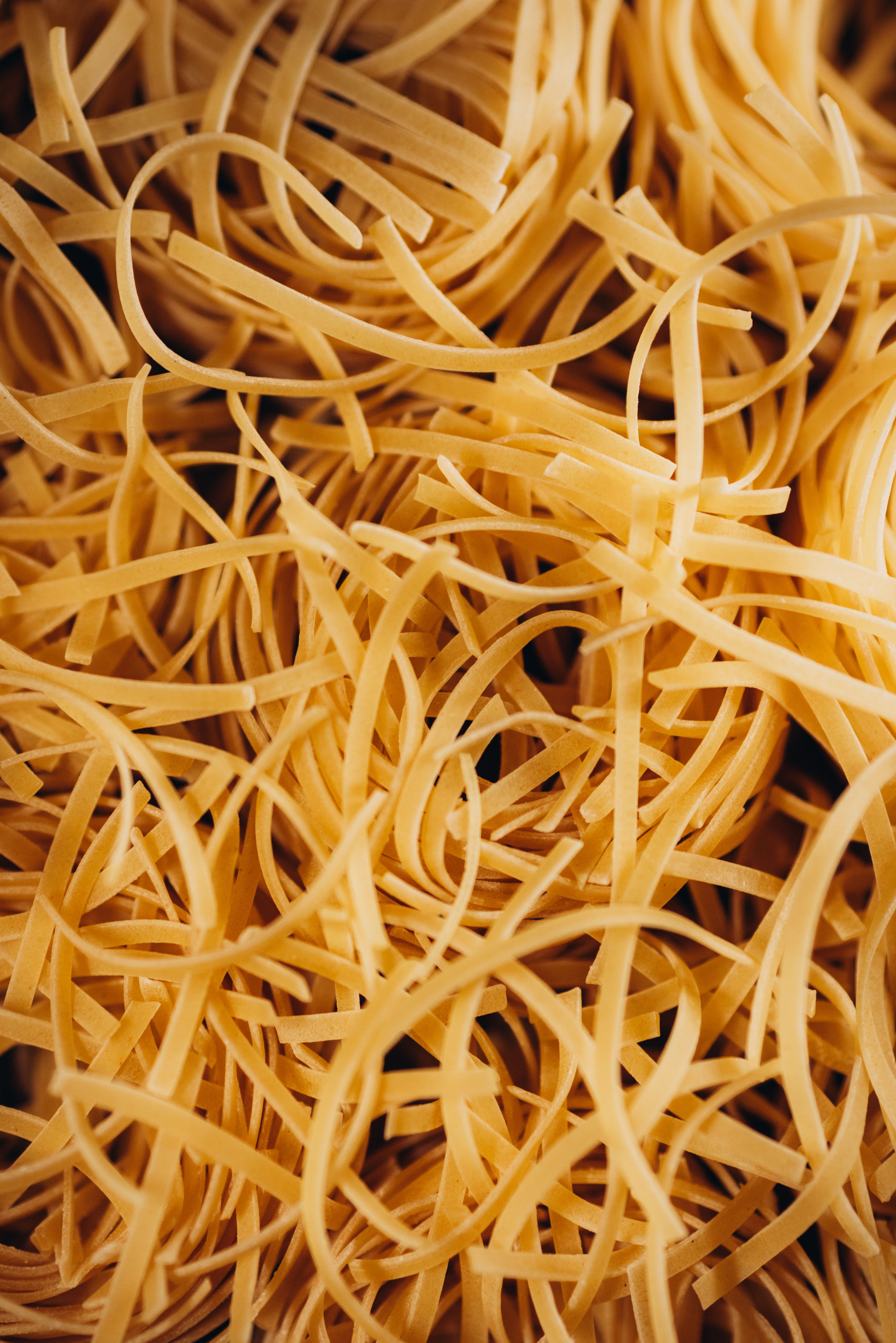 Close-up of Raw Spaghetti Pasta Texture · Free Stock Photo