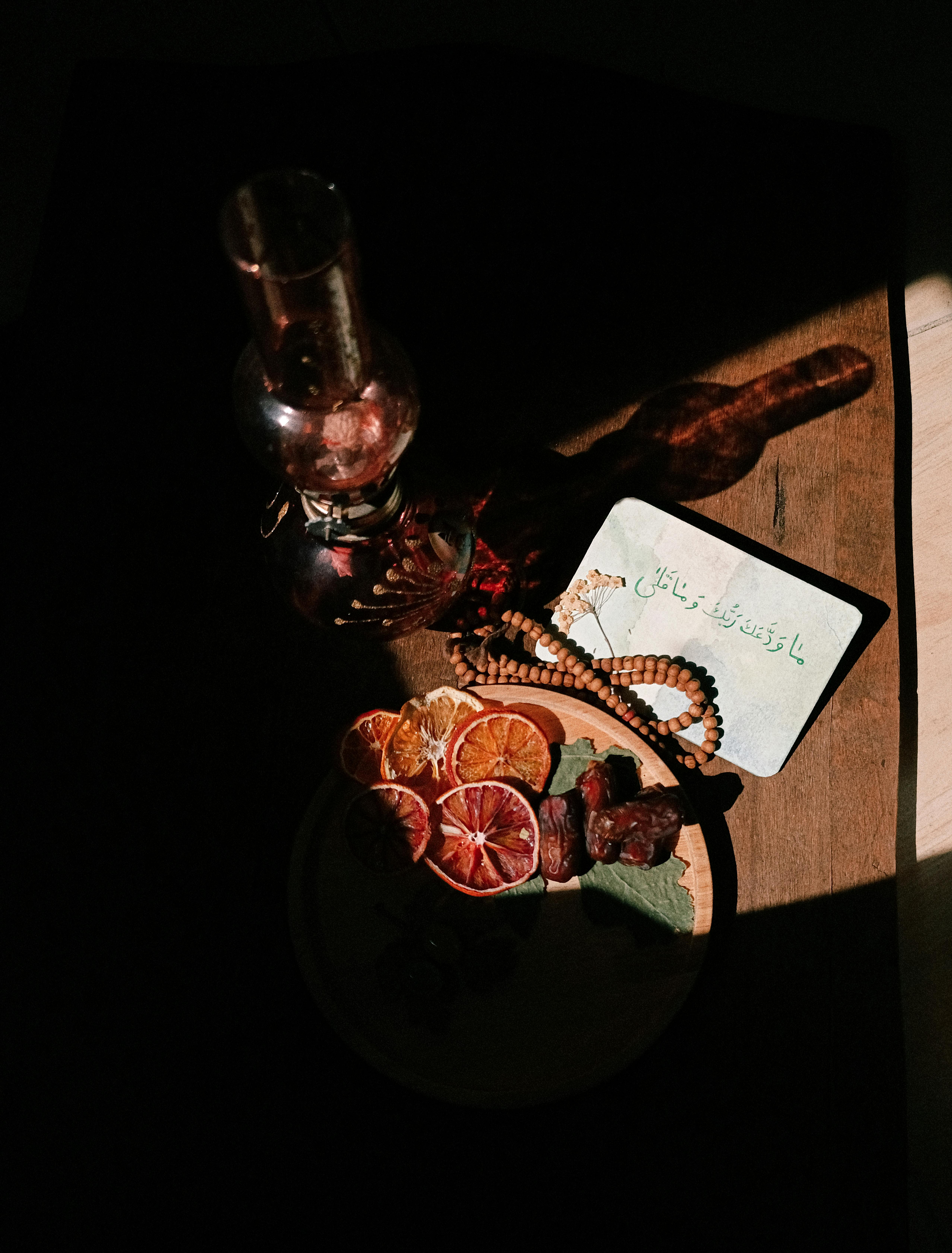 Free Artistic still life with lantern, dried fruits, and shadows. Stock Photo