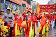 Colorful Traditional Parade with Dancers and Fans