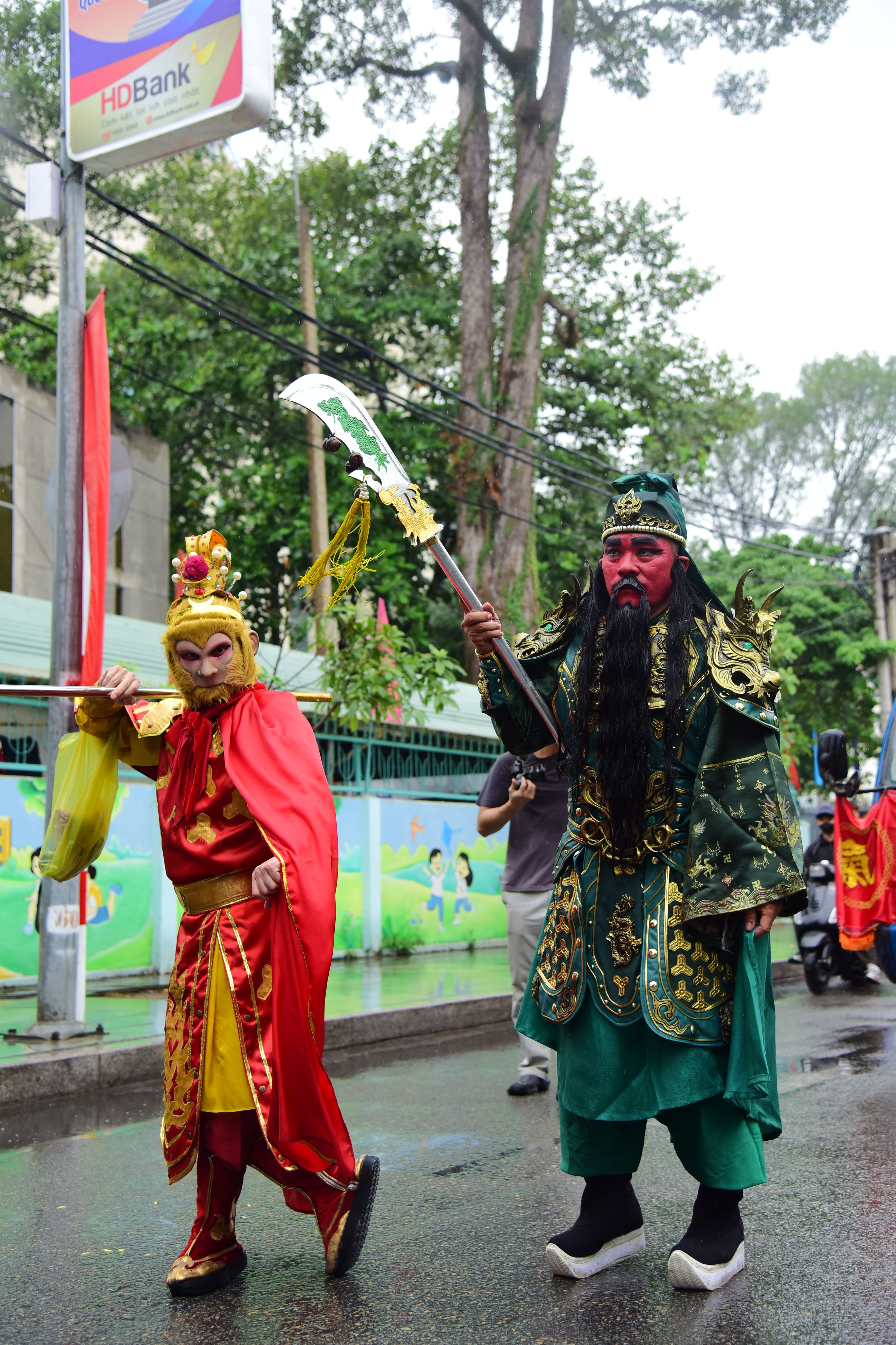 Vibrant street parade with performers in colorful traditional attire, showcasing cultural heritage.