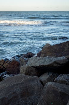 Calm waves breaking on rocky shore at Miramar, Provincia de Buenos Aires. Perfect natural background.