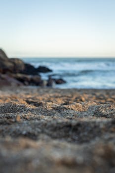 Tranquil beach scene with sandy foreground at Miramar, Argentina's Atlantic coast.