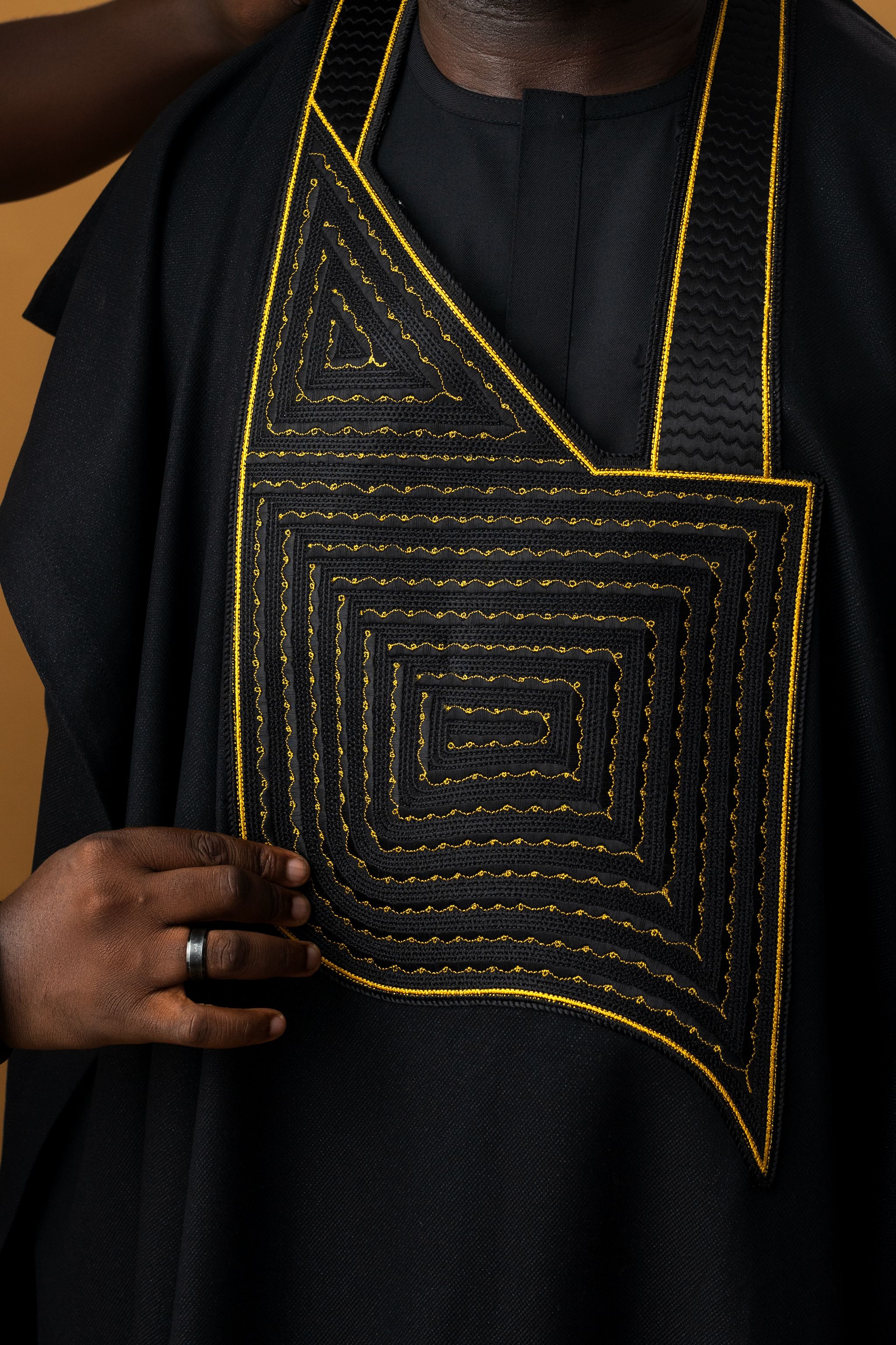 Traditional African Attire with Geometric Embroidery · Free Stock Photo