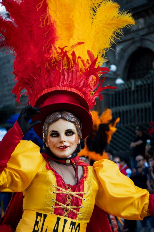 Free Colorful carnival costume with feathered headdress in Puebla, Mexico parade. Stock Photo