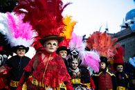 Colorful and festive costumes at Carnaval in Puebla, showcasing vibrant feathers and traditional attire.