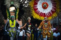 Vibrant traditional costumes at a festival in Puebla, Mexico, showcasing local cultural heritage.