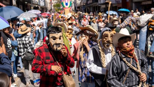 Free Colorful street parade with traditional costumes in Pachuca de Soto, Mexico. Stock Photo