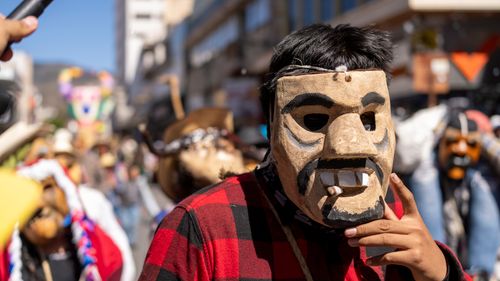 Free Colorful carnival parade features traditional masks in Pachuca, Mexico. Stock Photo
