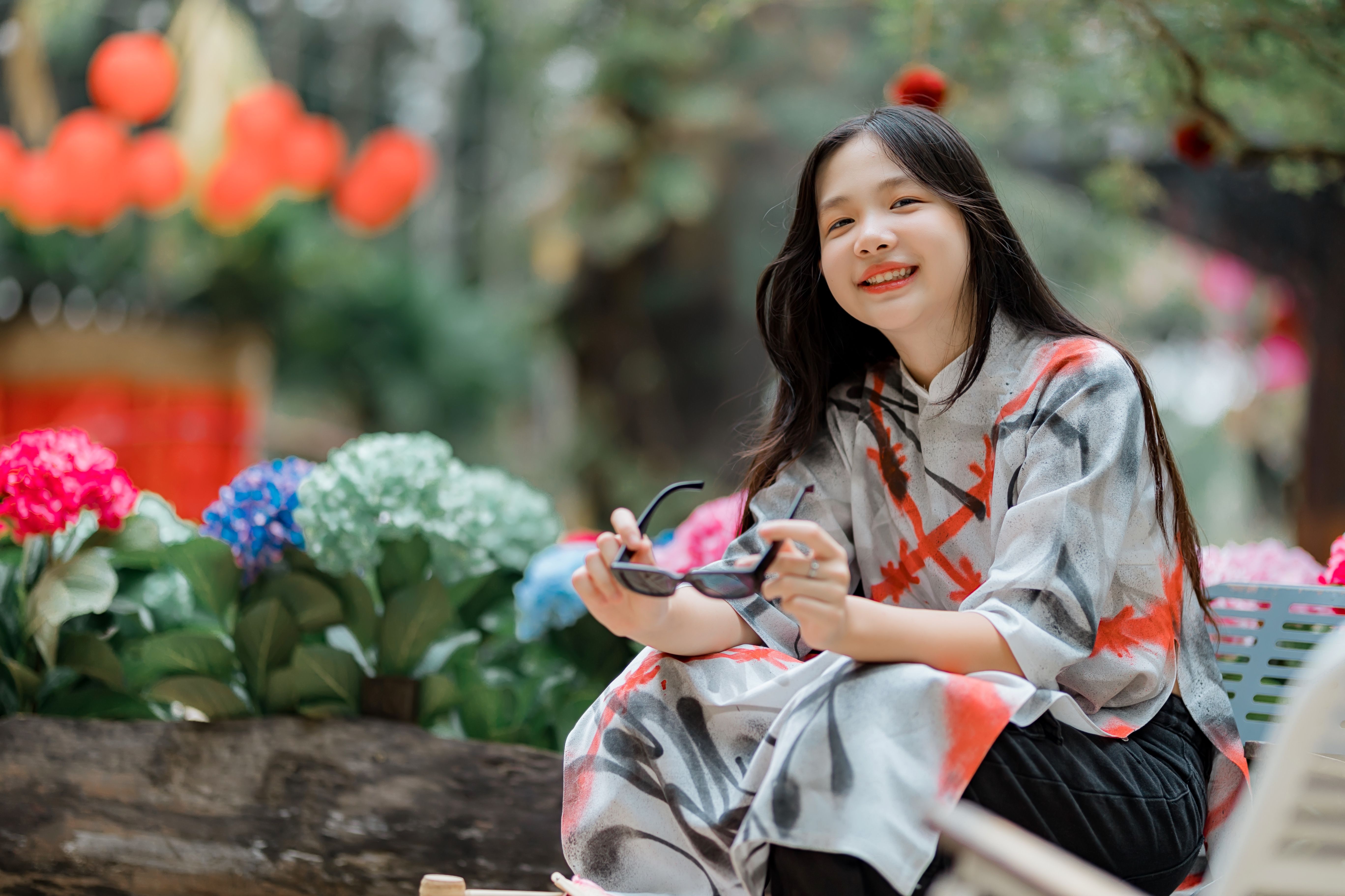 Smiling Woman in Traditional Dress Outdoors · Free Stock Photo