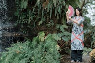 Serene Portrait of Woman by a Waterfall