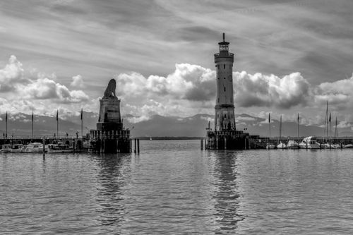 Free Scenic black and white photo of Lindau Harbor with lighthouse and lion statue in Germany Stock Photo