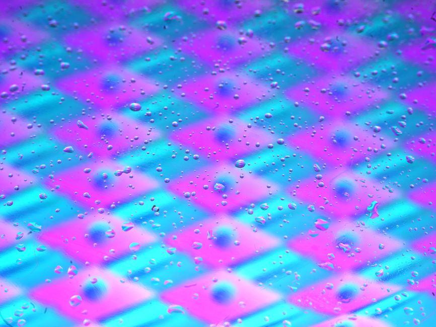 Colorful abstract background with water droplets on pastel checkered pattern.