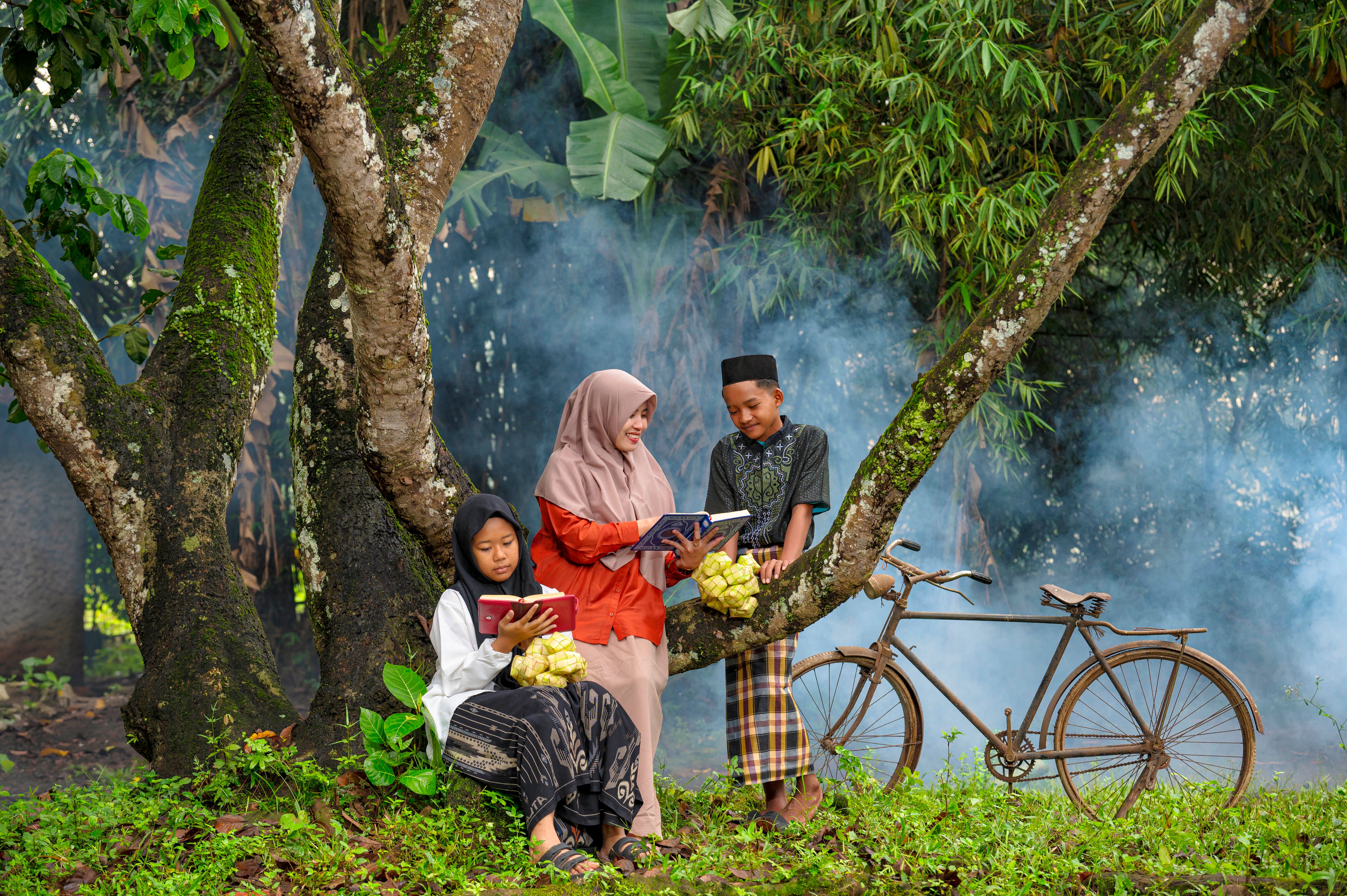 Children Reading Outdoors in Banten Forest