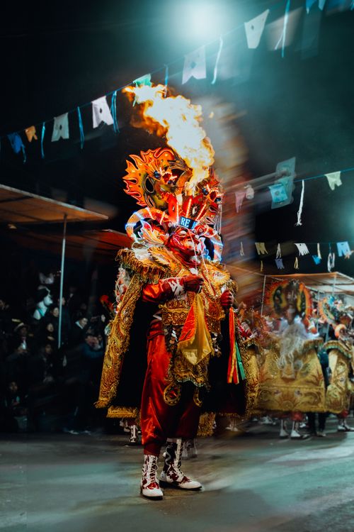Free Diablada dancer in vibrant costume at Bolivia carnival with fiery headdress and festive atmosphere. Stock Photo